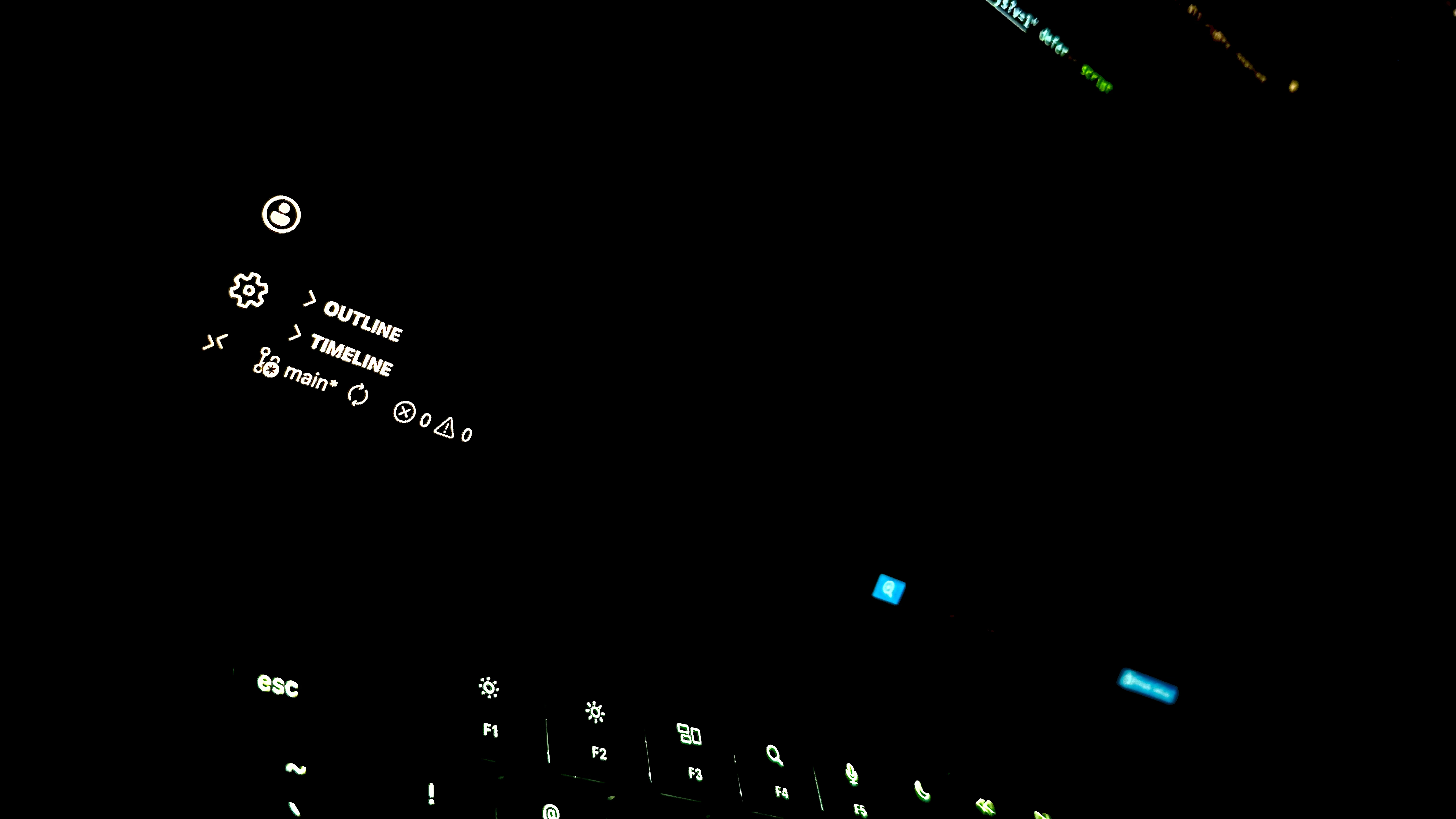 Dark developer workspace with keyboard lighting and coding interface glow